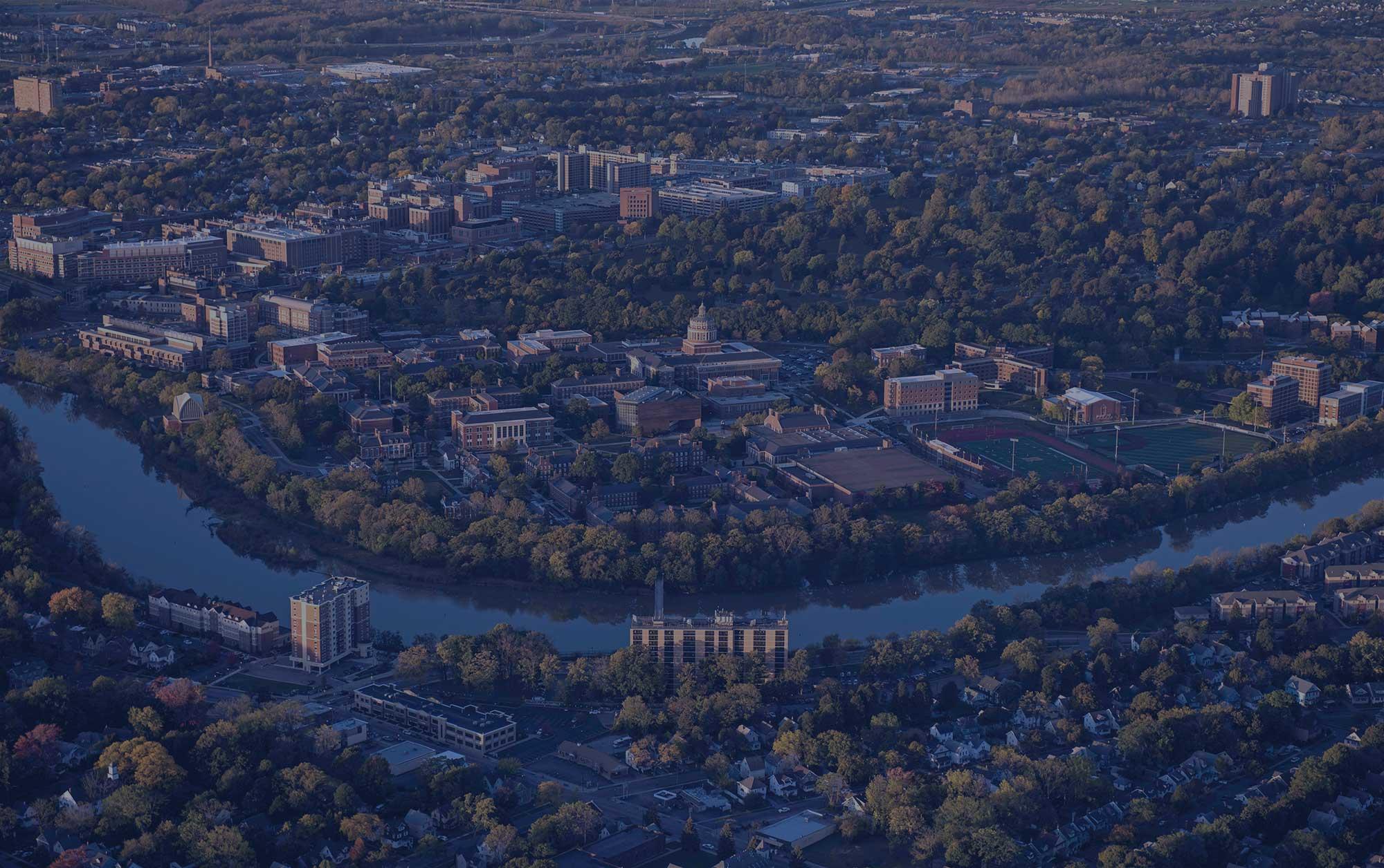 aerial image of the u of r campuses and genesee river with blue overlay